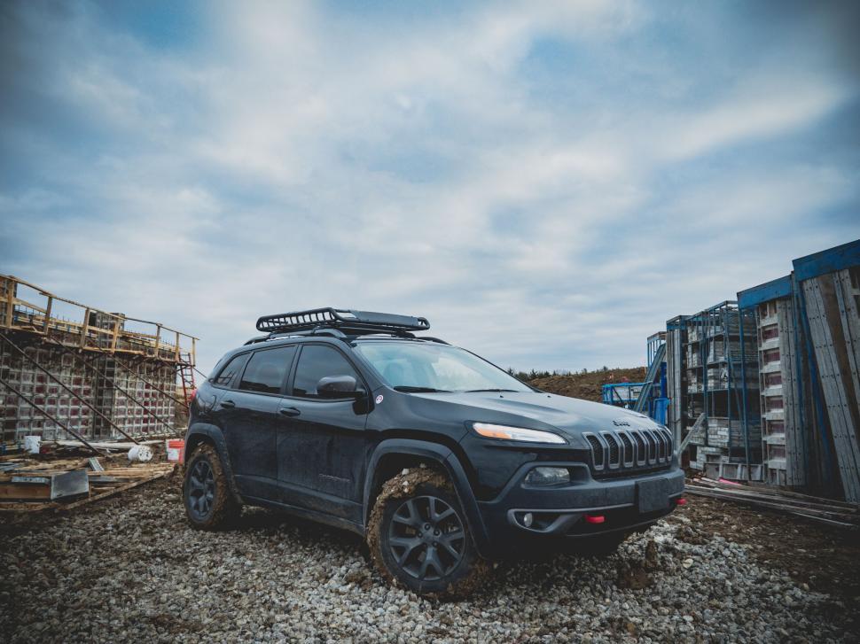 Free Image of Jeep Cherokee parked at a construction site 