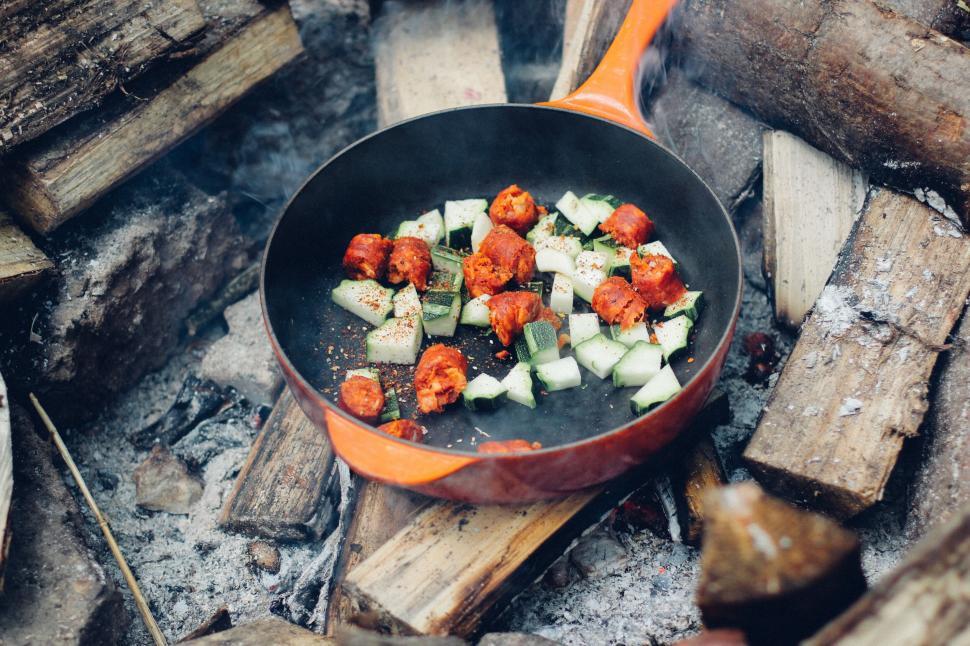 Free Image of Campfire cooking with vegetables and sausages 