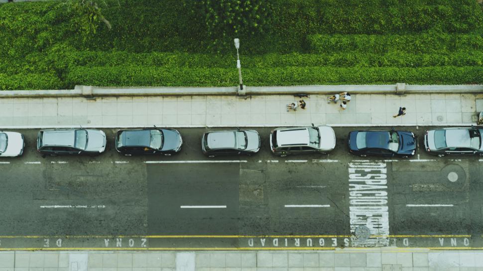 Free Image of Aerial view of a street with parked cars 
