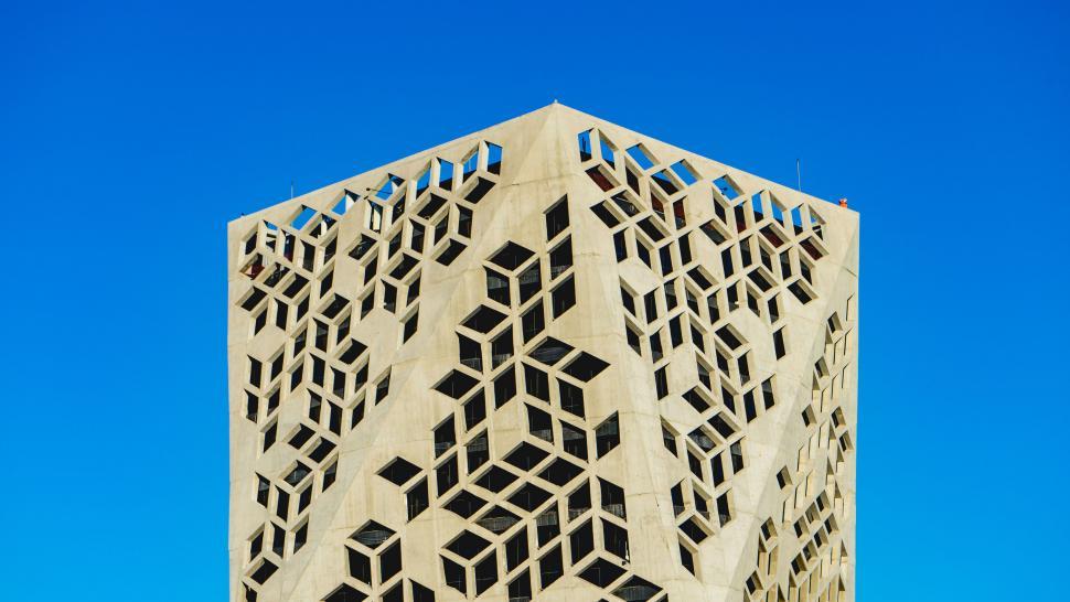 Free Image of Modern geometric architecture against a clear sky 