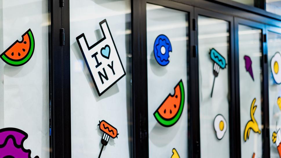 Free Image of Sticker-covered glass door at a business 
