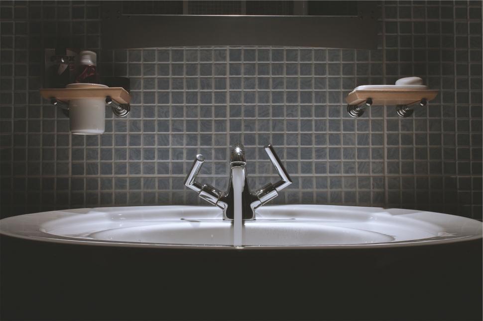 Free Image of Bathroom sink with a mirror reflection 