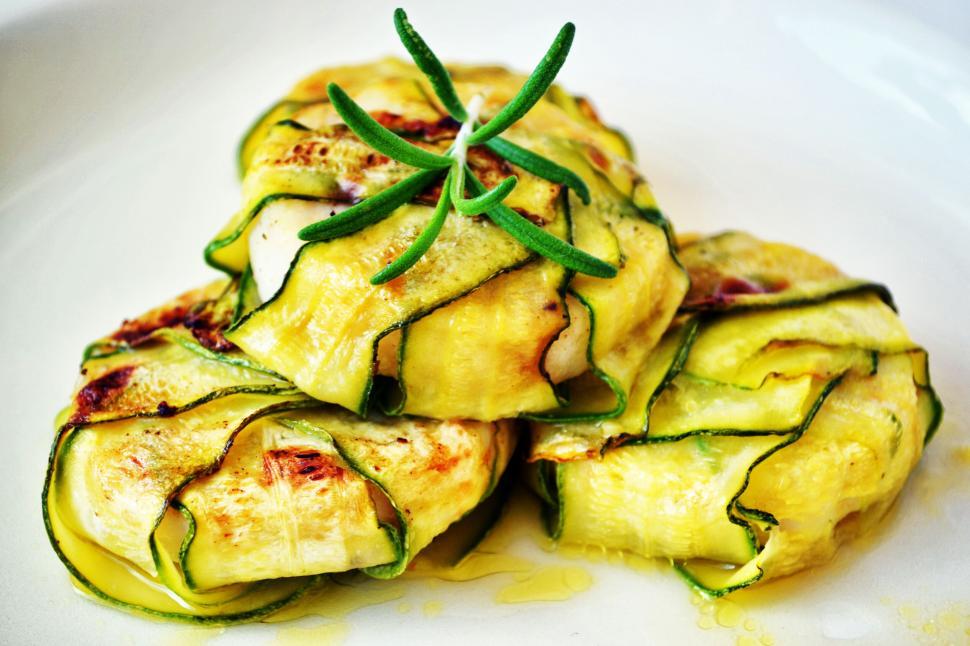 Free Image of Grilled zucchini rolls garnished with rosemary 