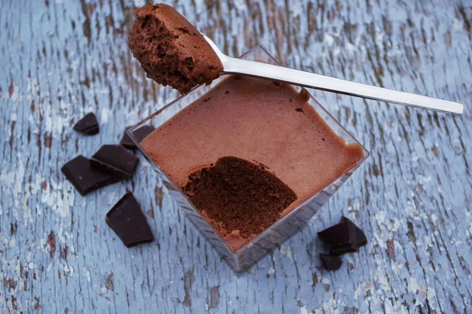 Free Image of Chocolate mousse with a spoon on a rustic table 