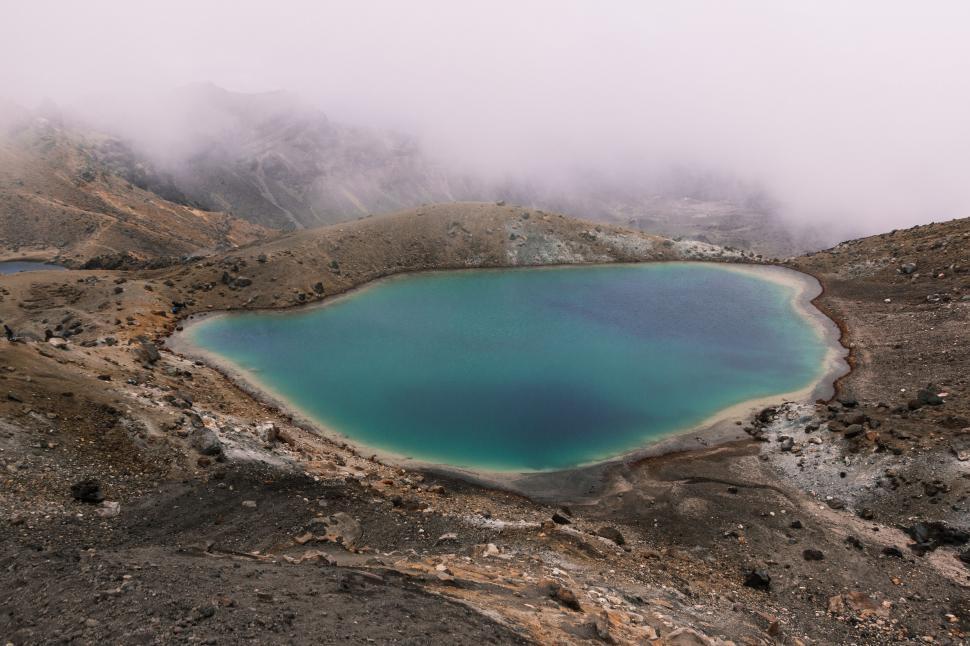 Free Image of Volcanic crater lake with misty mountains 
