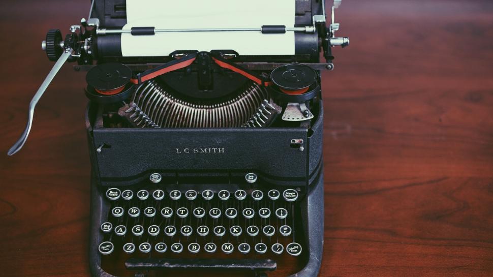 Free Image of Vintage typewriter with paper on wooden desk 