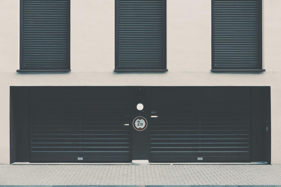 Free Image of Minimalistic image of a garage door with shutters 