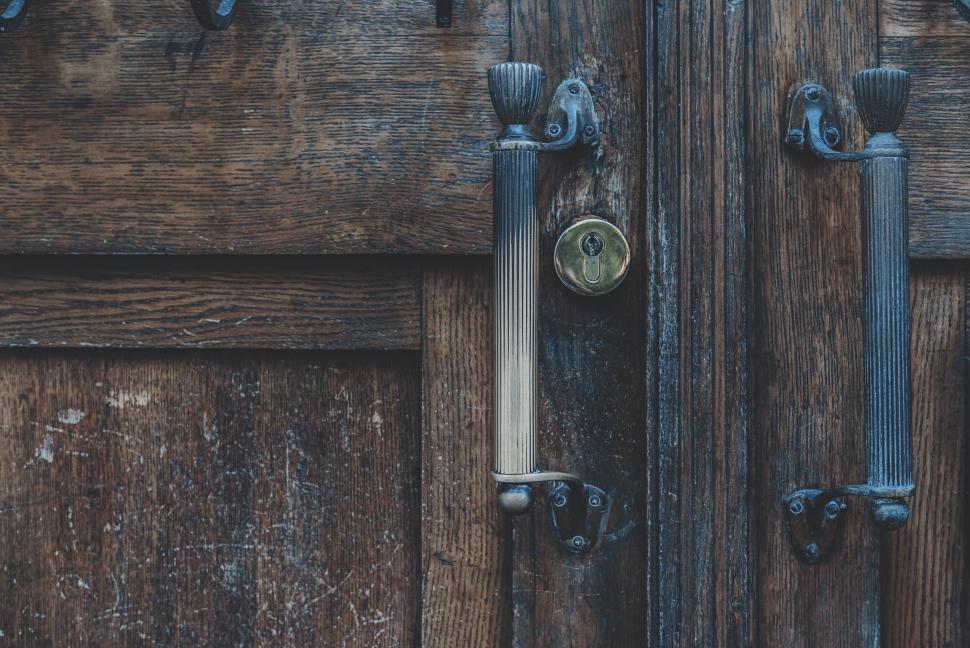Free Image of Antique wooden door with iron handles 