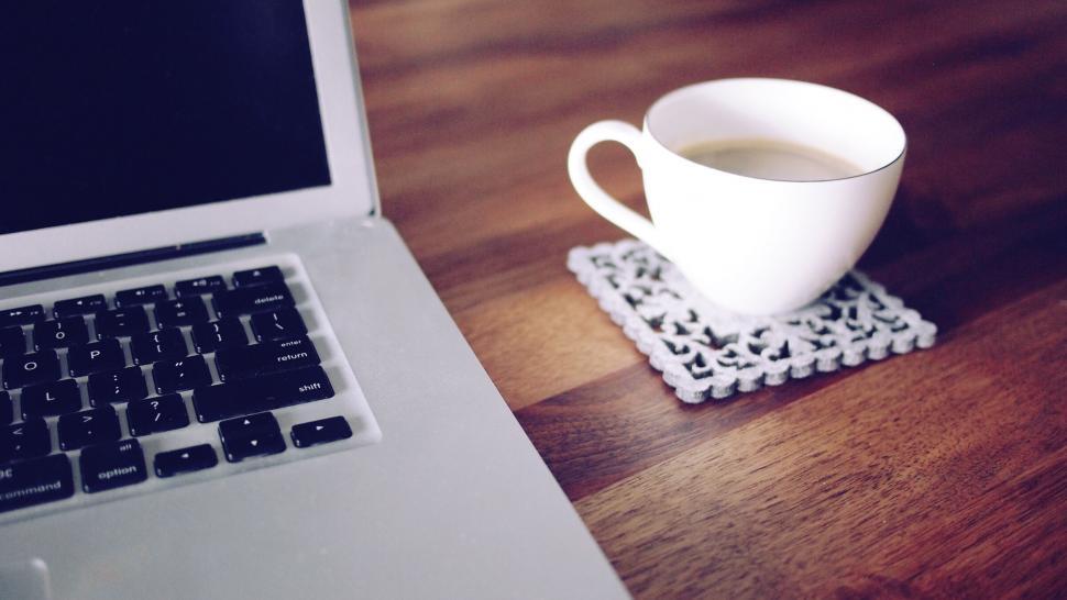 Free Image of Work from home setup with coffee cup 