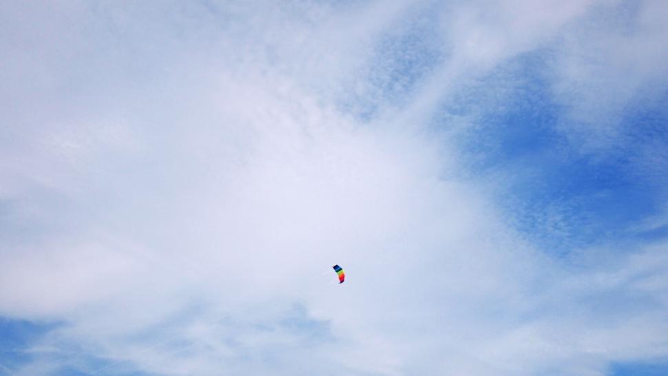 Free Image of Colorful kite flying in blue sky 