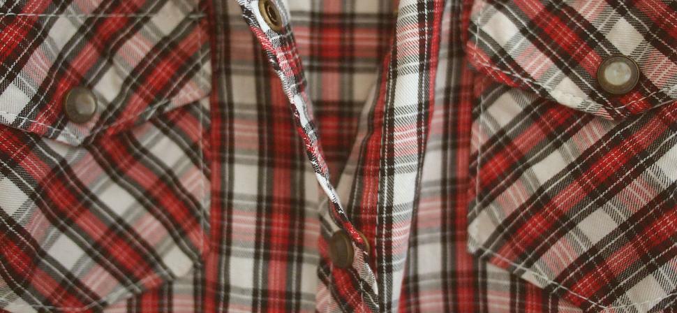 Free Image of Close-up of plaid fabric texture on clothing 
