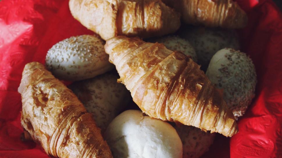 Free Image of Assorted croissants on vibrant red cloth 