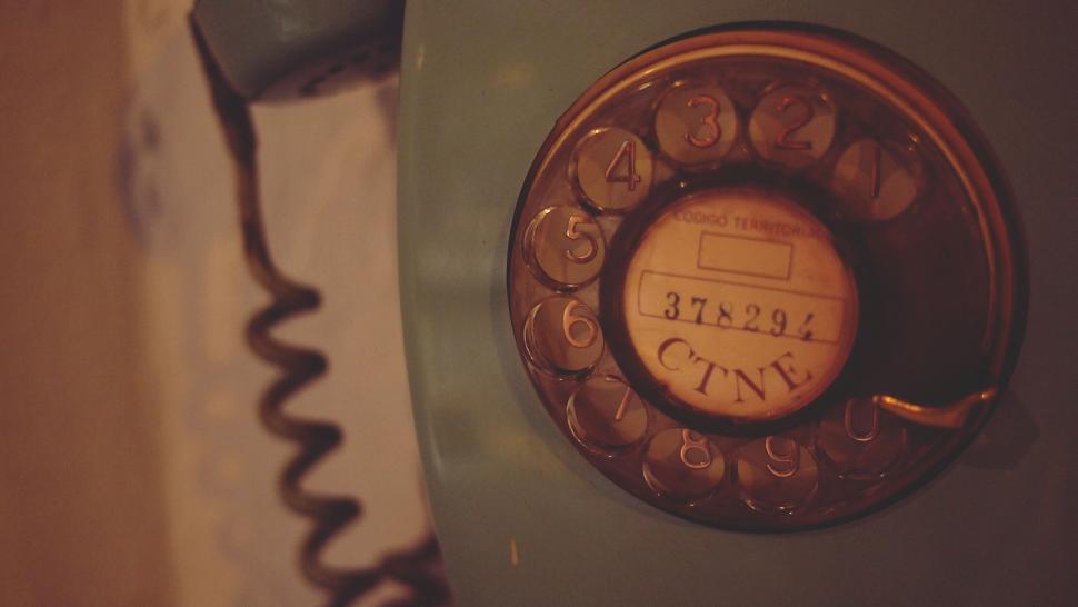Free Image of Vintage rotary phone in dim light 