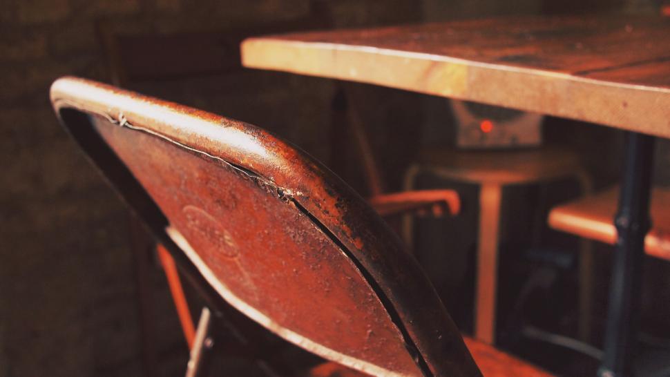 Free Image of Vintage chair and desk with warm tones 