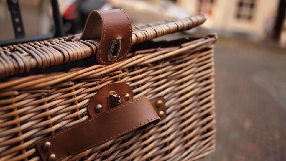 Free Image of Close-up of a wicker basket with leather strap 