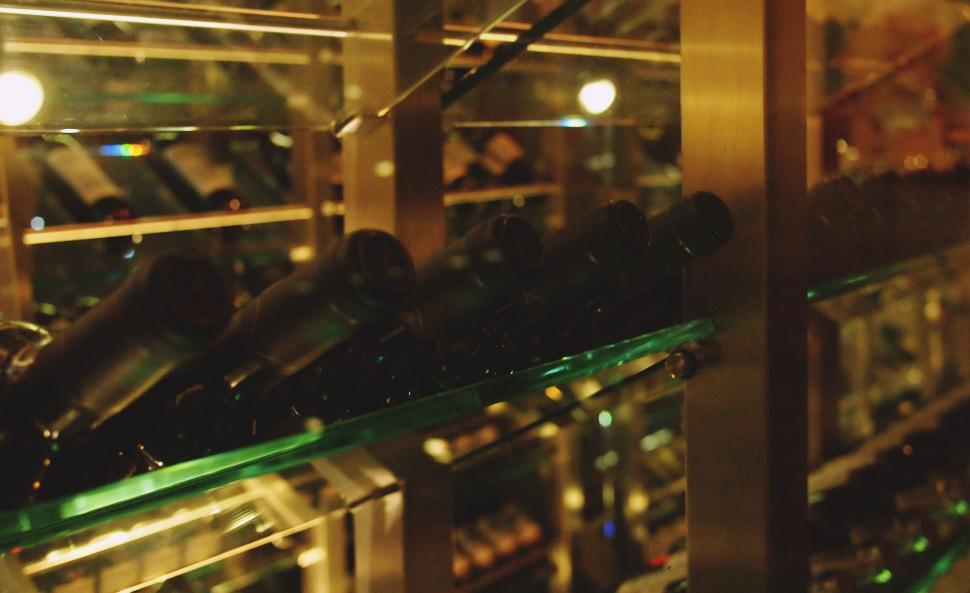 Free Image of Wine bottles in a modern wine cellar 