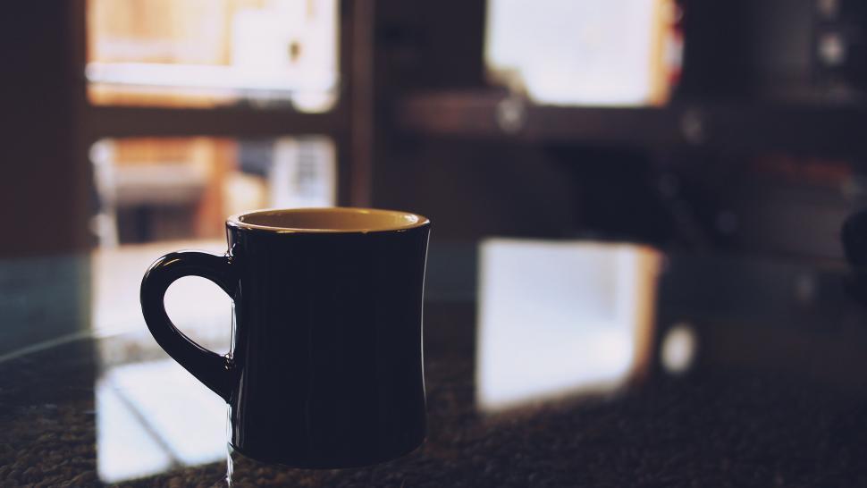Free Image of Steamy black coffee mug on a table 