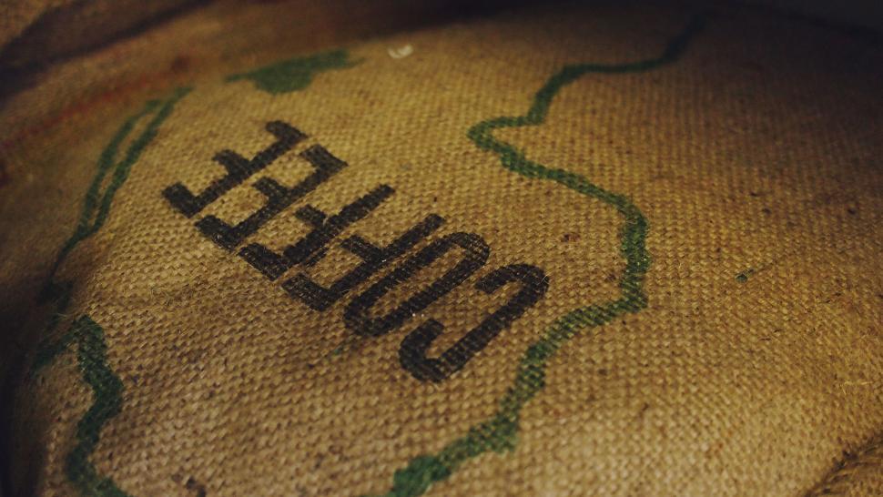 Free Image of Close-up of a burlap coffee bag with text 