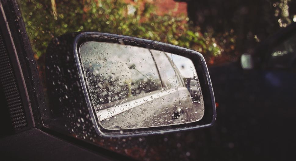 Free Image of Rainy day viewed through a car side mirror 