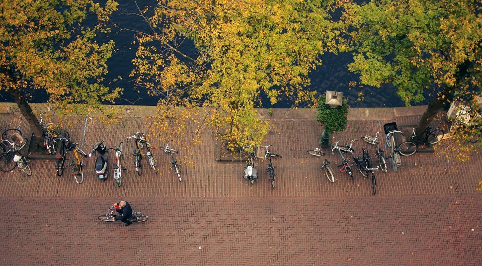 Free Image of Overhead view of bicycles parked on city street 