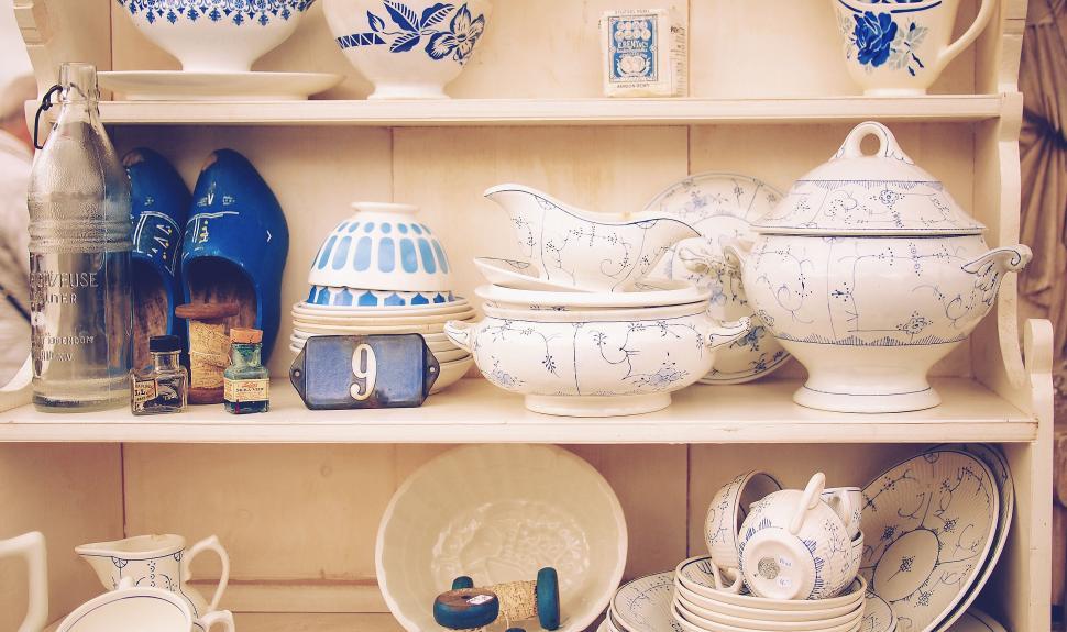 Free Image of Vintage porcelain dishes on wooden shelves 