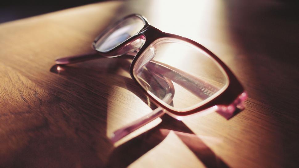 Free Image of Eyeglasses casting a long shadow in sunlight 