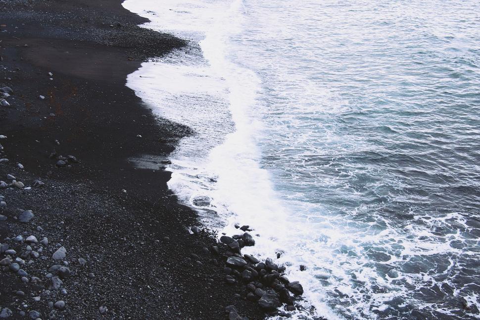 Free Image of Shoreline of a black pebble beach 
