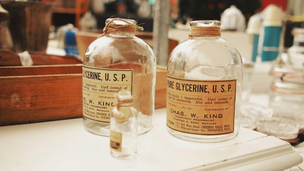 Free Image of Vintage glycerine bottles on display 