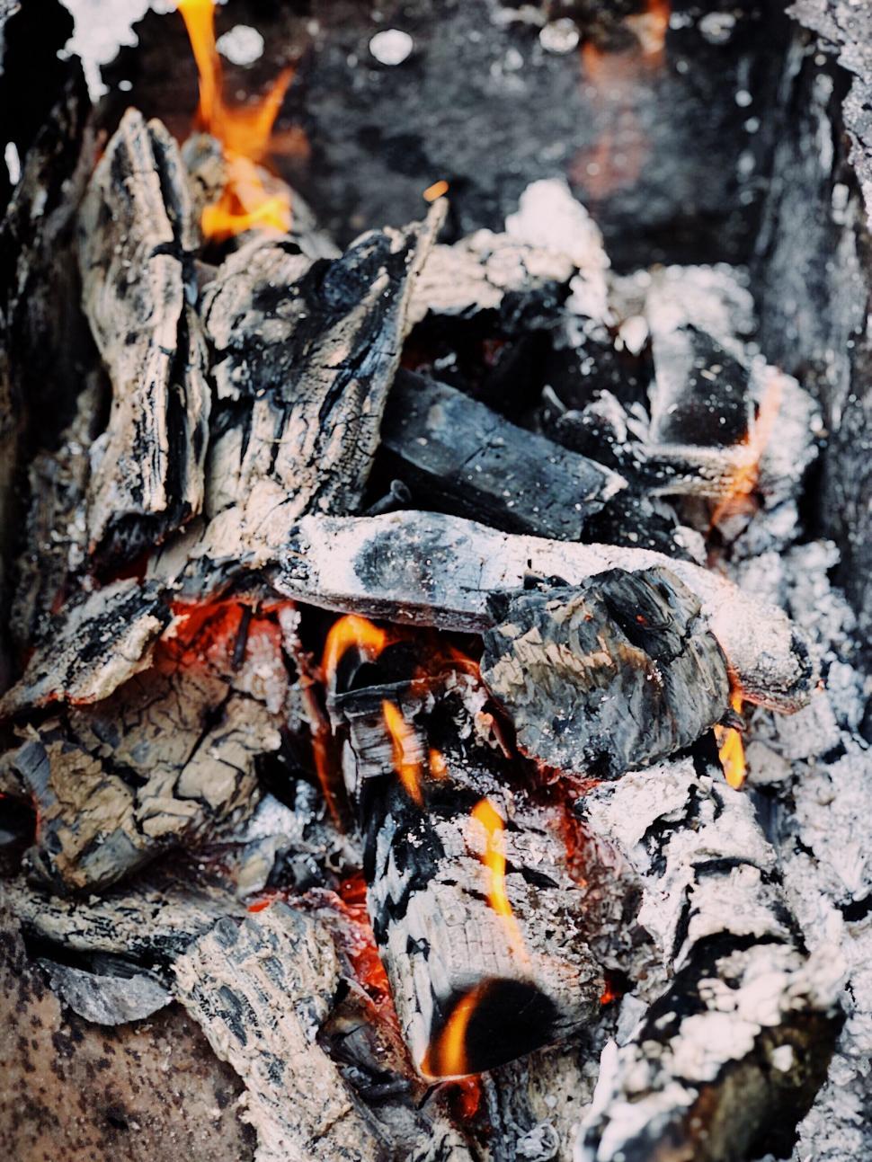 Free Image of Intense embers smoldering in a fire pit 