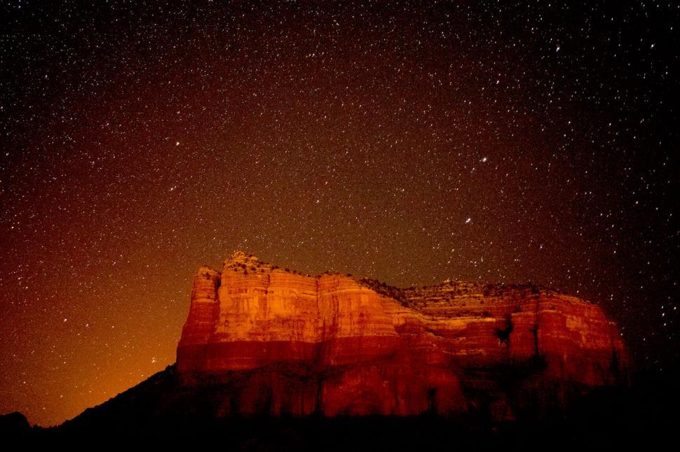 Free Image of Starlit Sky Over Silhouetted Rock Formations 