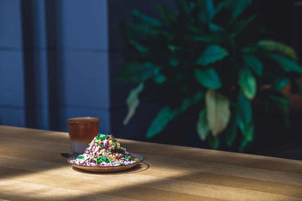 Free Image of Healthy poke bowl and a drink on table 