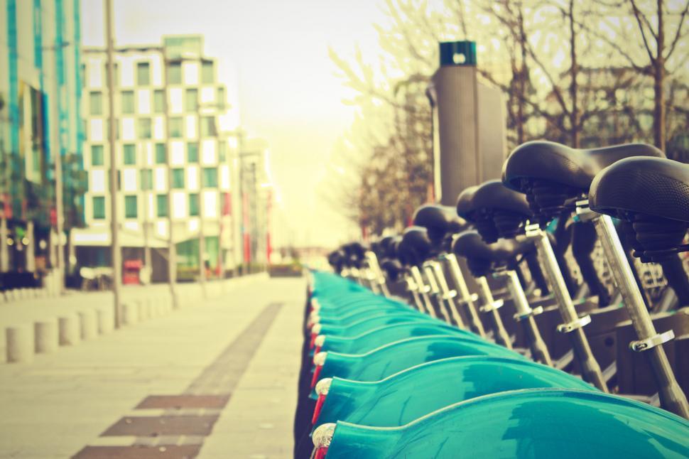 Free Image of Row of bicycles for rental in urban setting 