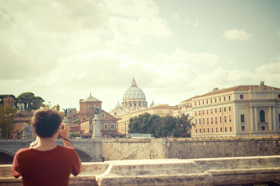 Free Image of Tourist capturing a glimpse of Vatican City 