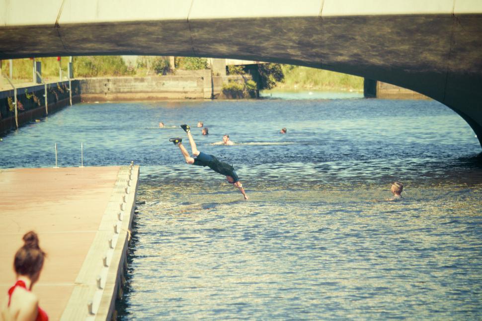 Free Image of Jumping off a dock into the river 