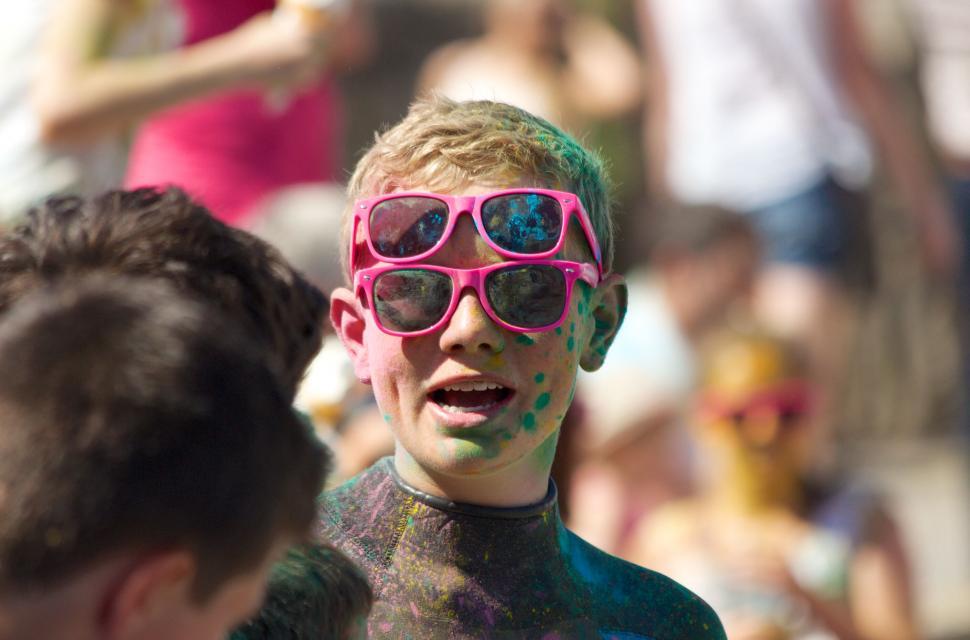 Free Image of Boy covered with colorful powder at event 