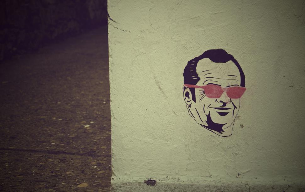 Free Image of Graffiti of a man s face with red glasses 