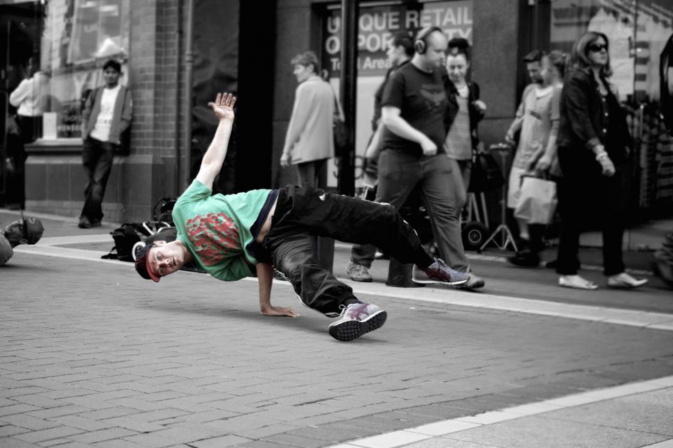 Free Image of Breakdancer performing on the city street 