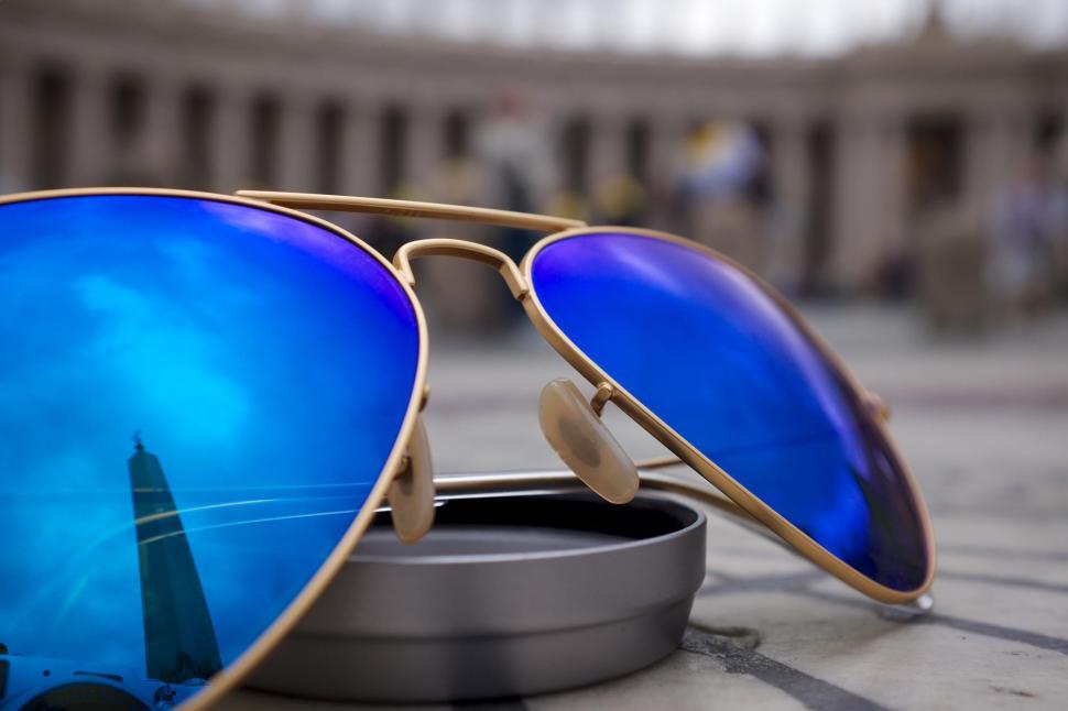 Free Image of Blue reflective sunglasses with city reflection 