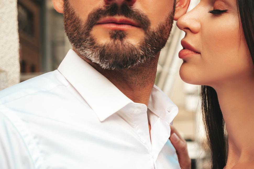 Free Image of A man and woman looking at each other 
