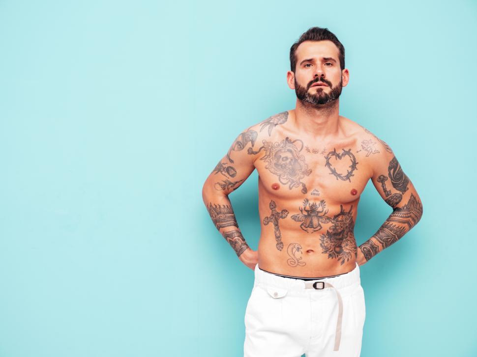 Free Image of A man with tattoos on his body 