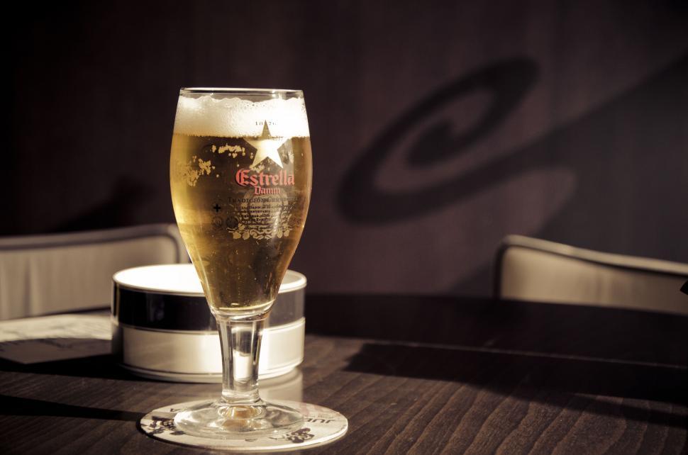 Free Image of Cold beer in glass with Estrella branding 