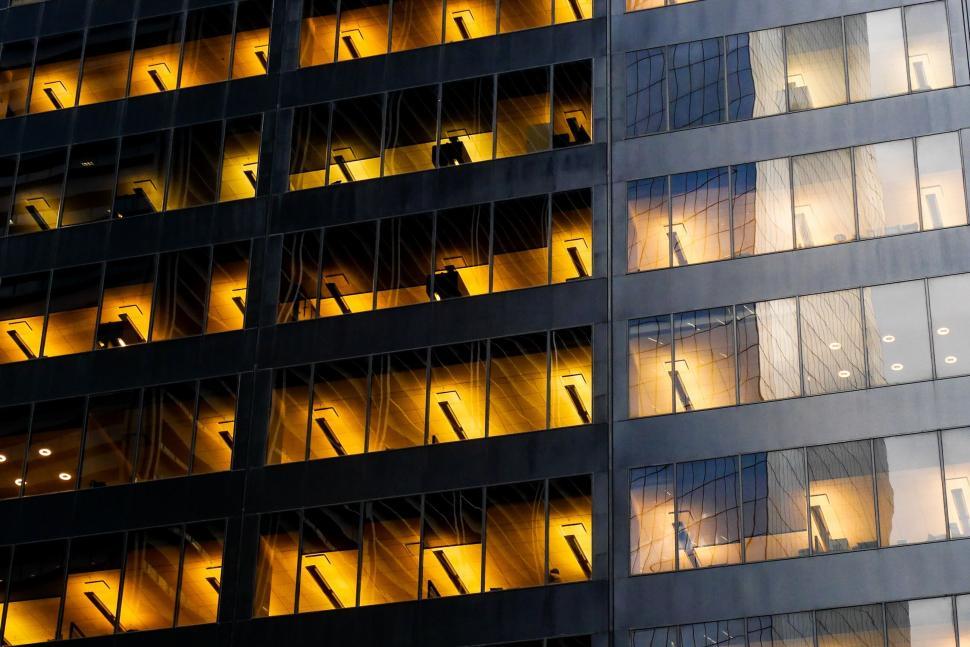 Free Image of Modern office building facade at night 