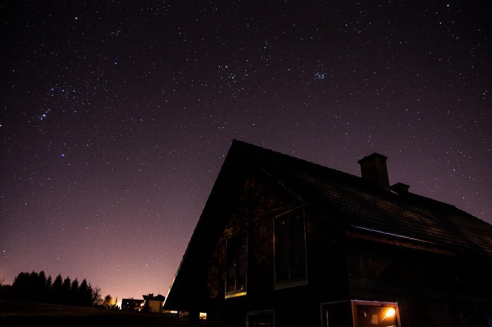Free Image of Starry Night Sky Over Countryside House 