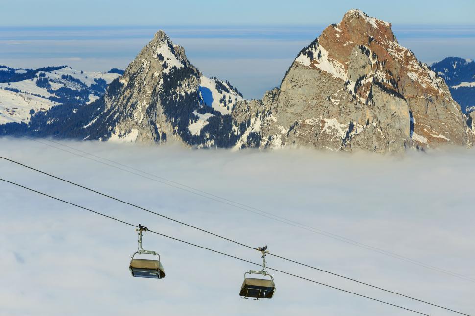 Free Image of Cable cars over foggy mountain landscape 