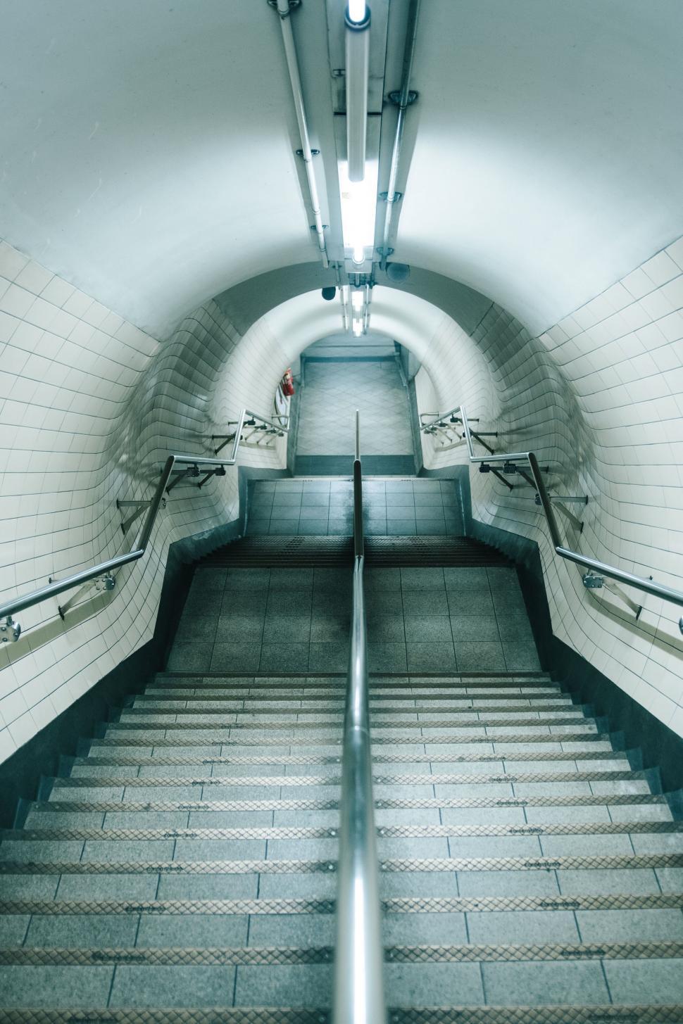 Free Image of Symmetrical stairway in a tunnel-like station 