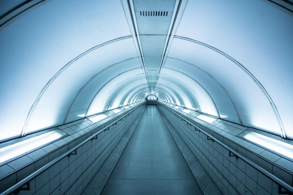 Free Image of Futuristic tunnel with cool blue lighting 