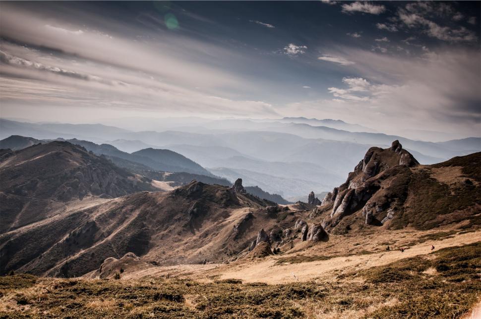 Free Image of Rugged mountain terrain under a dramatic sky 