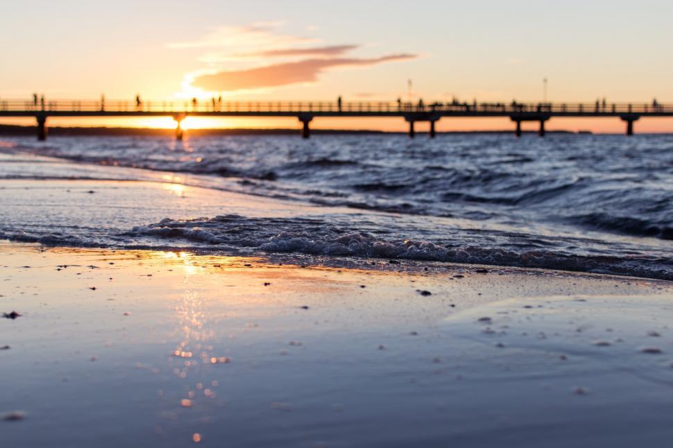 Free Image of Sunset view over the sea with pier 