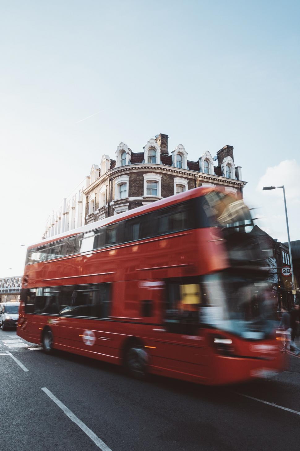 Free Image of Red double-decker bus speeding in London 