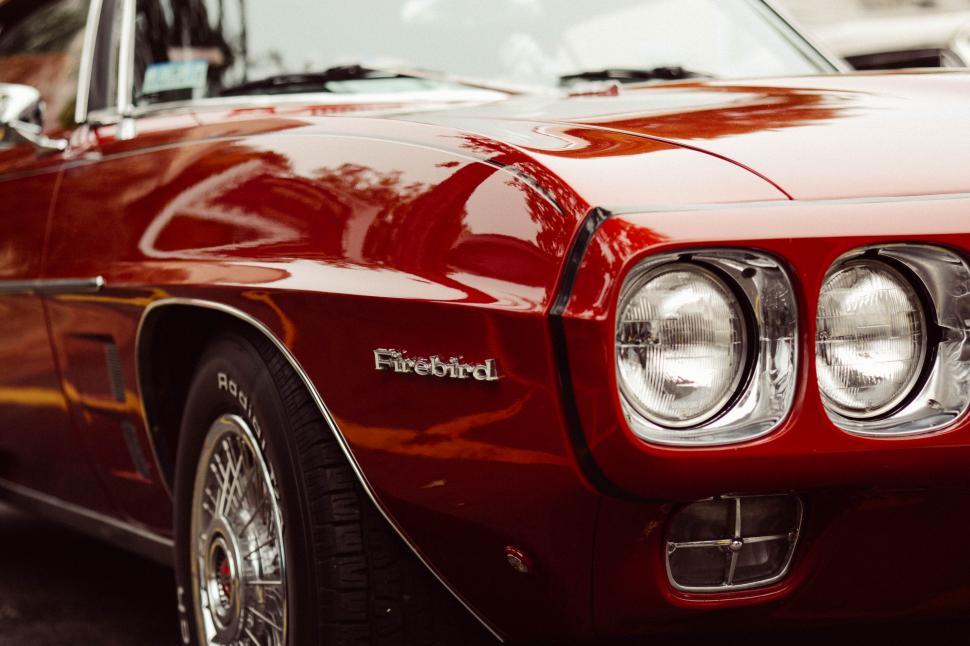 Free Image of Vintage red Firebird car close-up 